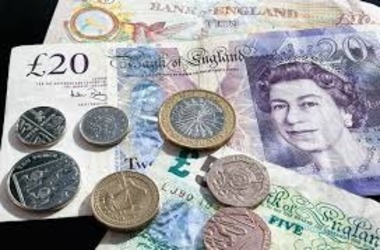 Sterling Slips as Bank of England Signals Potential Rate Cut